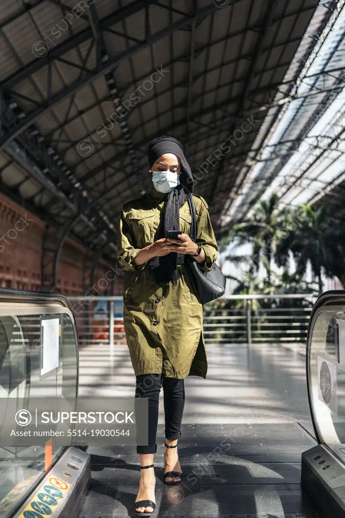 Bussiness muslim woman on a train station
