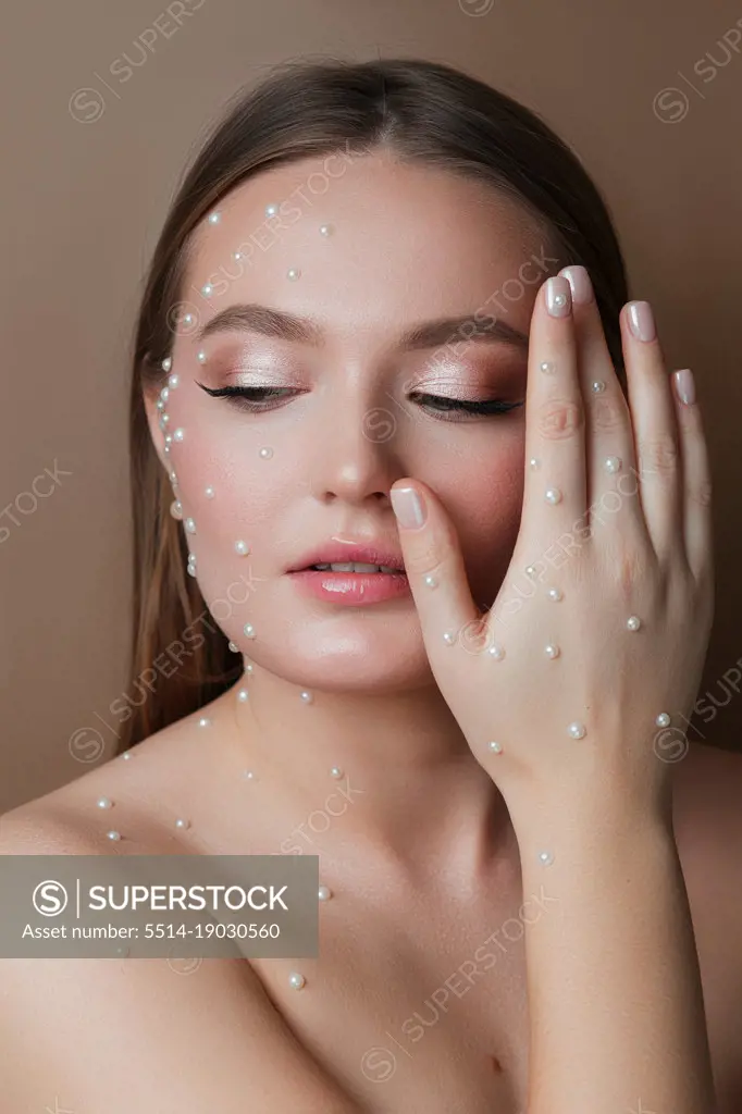 Girl with pearls on her face