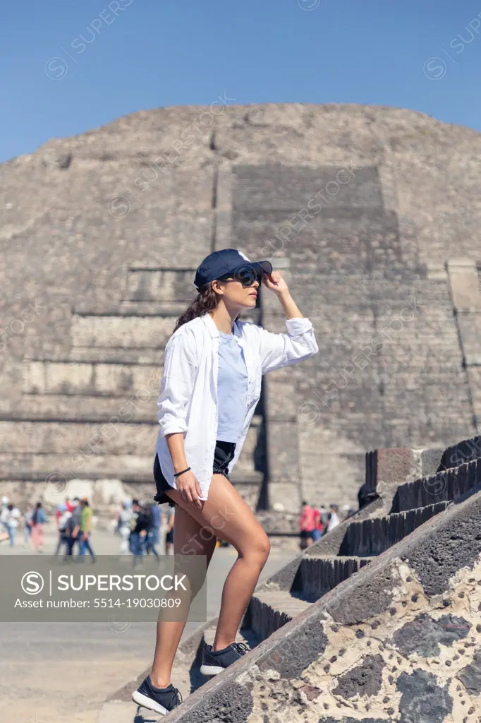Young woman walking around Teotihuacan archeological site in Mexico