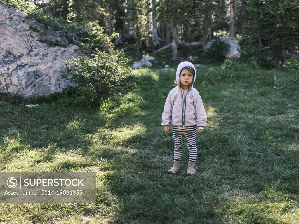 Girl standing in a forest, Colorado