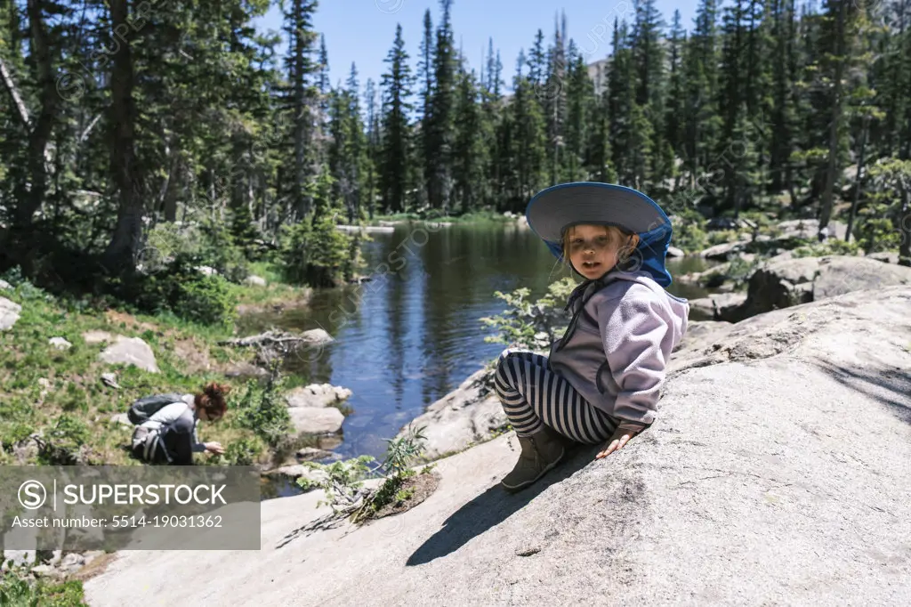 Girl resting on a rock near Sopris Lake, Colorado