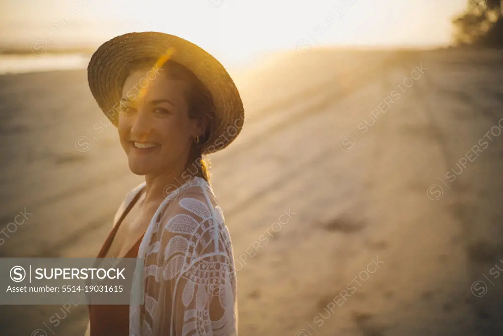 beauty backlighting portrait of a blond girl in the beach