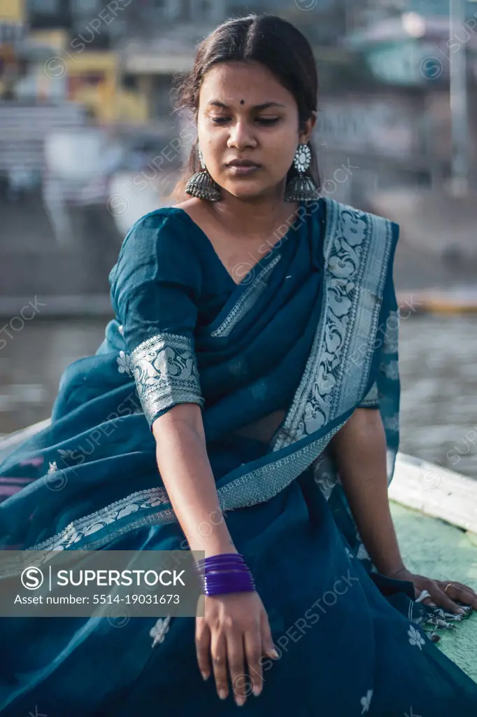 Woman sitting in boat in Varanasi India