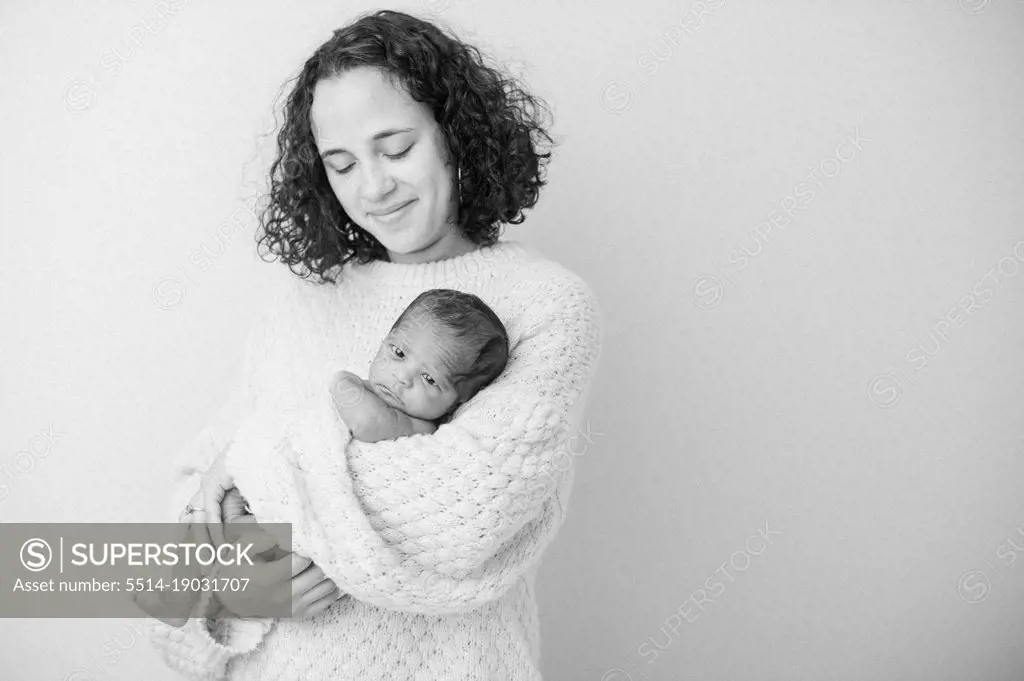 Black and White portrait of a Mother holding her newborn baby
