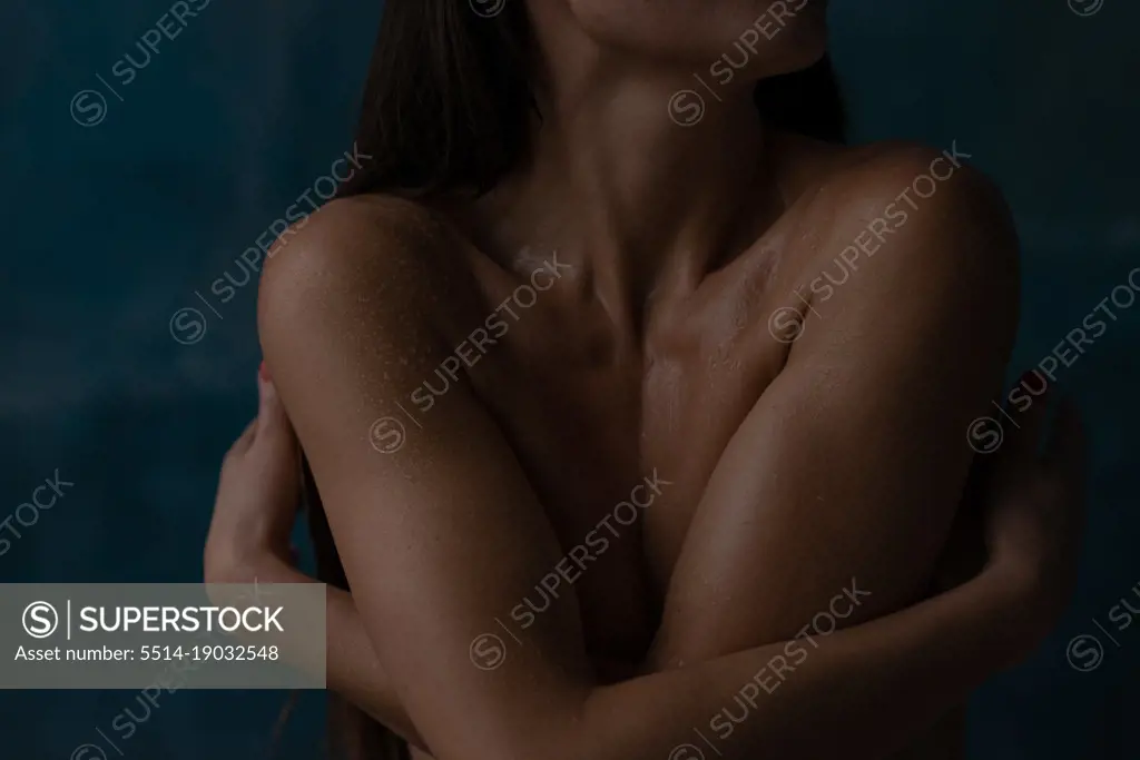 Beautiful burn woman embracing herself with naked body