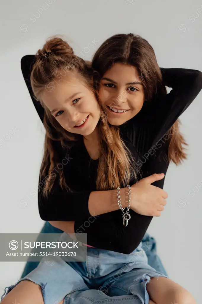 Ukrainian happy sisters hug each other. Concept of love and peace