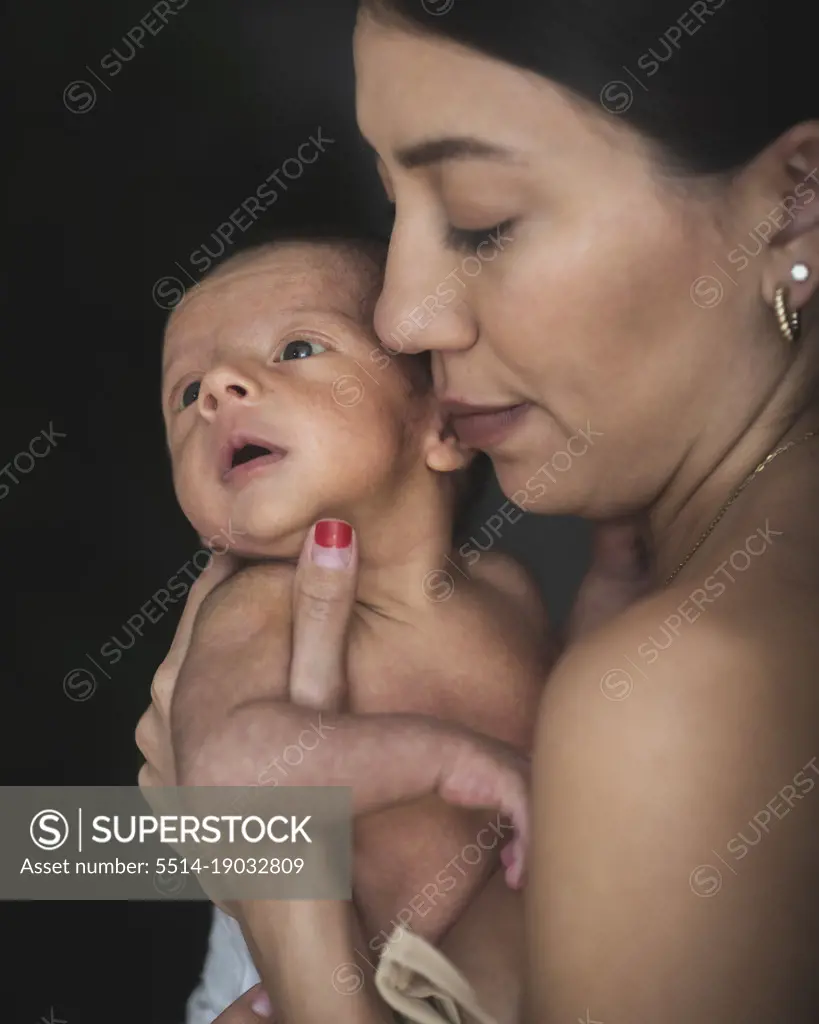 Latin Mom with her cute new born