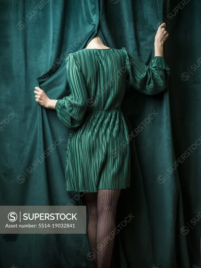 Girl in green with no visible face