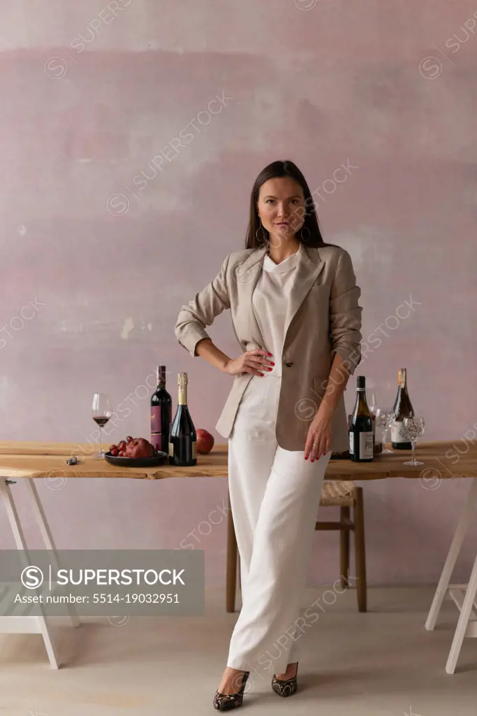 Confident woman in jacket on degustation on wine