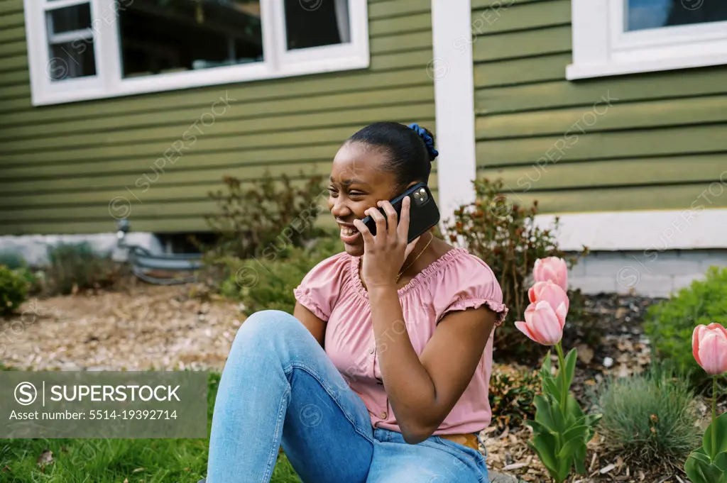 Teenage girl talking while on a phone call