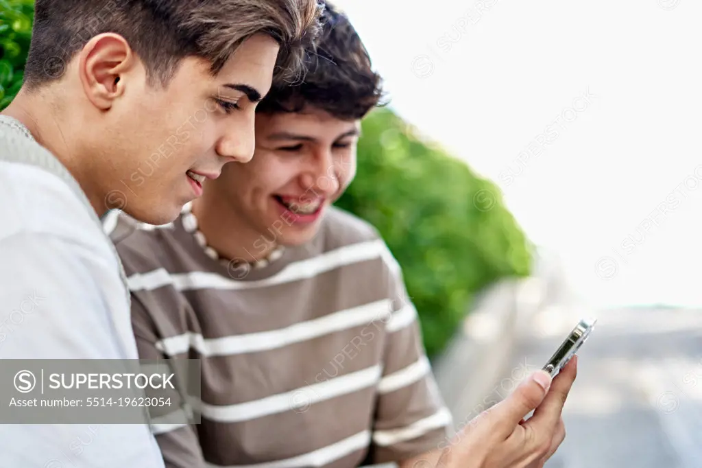 Man Shows His Boyfriend A Video On His Phone