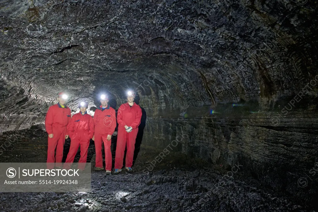 group of scientists exploring the Leidarendi lava cave in Iceland