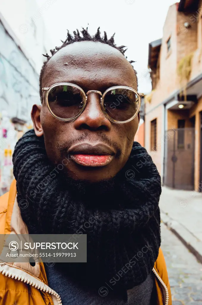 close up vertical portrait of serious african man outdoors
