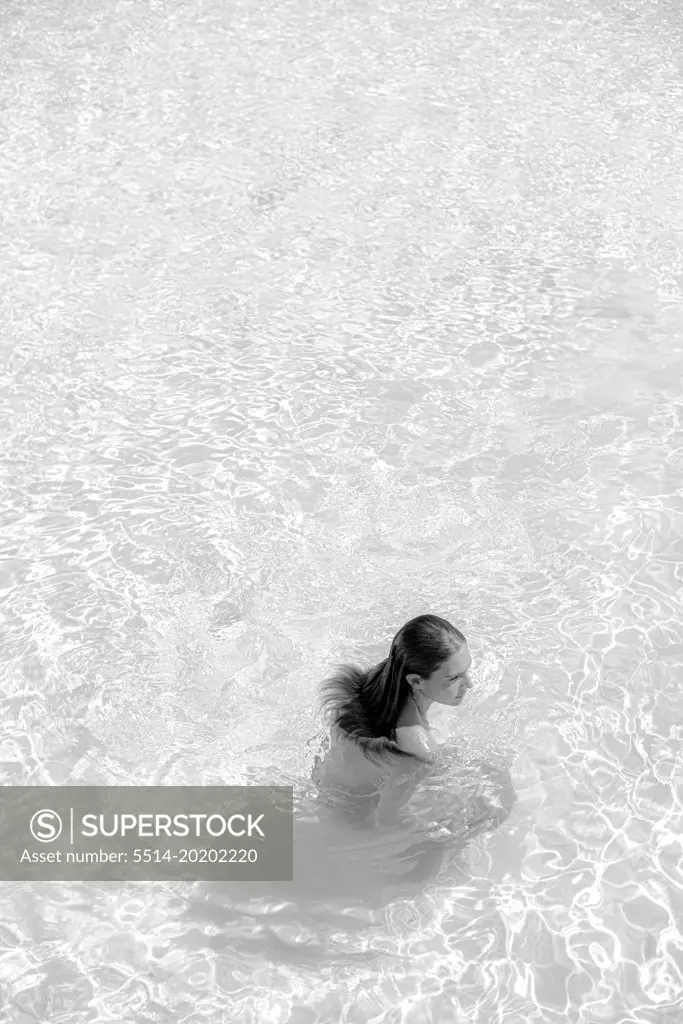 simply portrait in black and white of a girl on the ocean