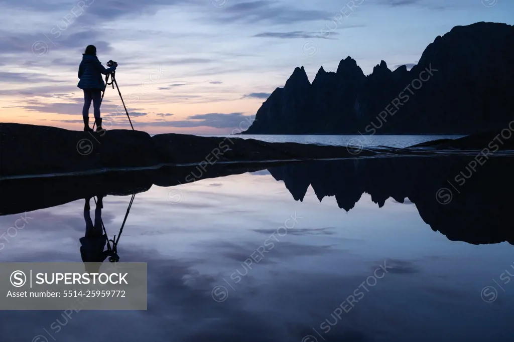 Photographer and Okshornan at Tungeneset viewpoint, Senja, Norway