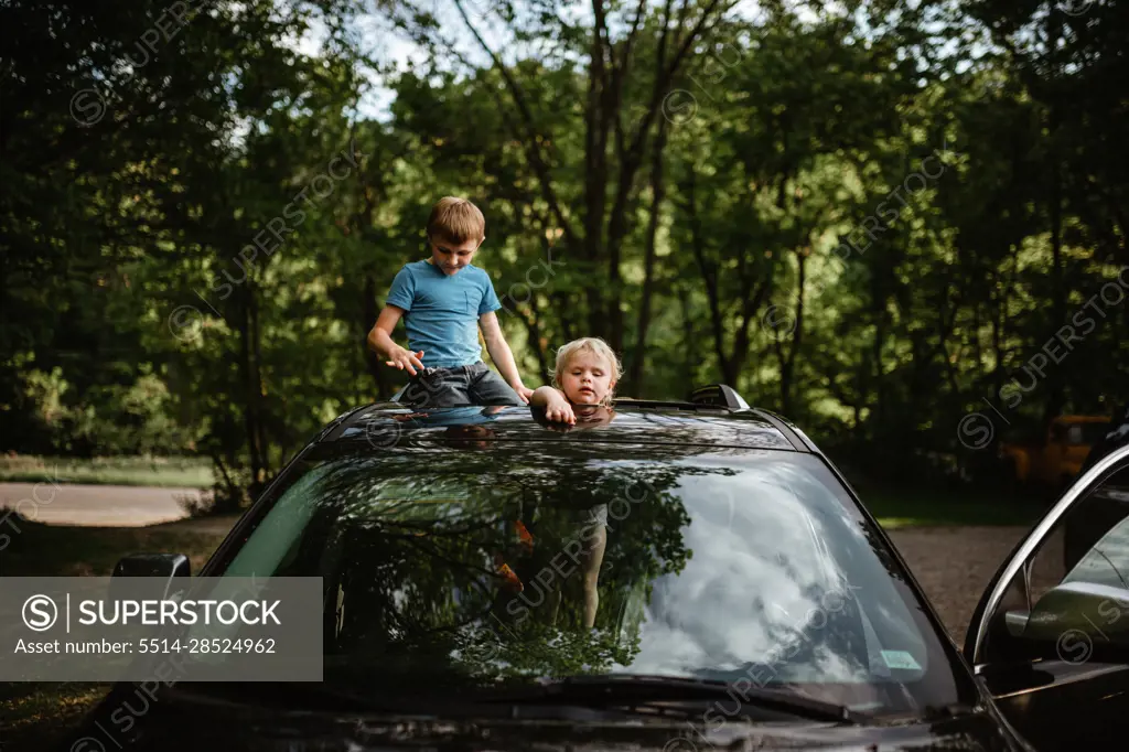 Kids playing in car at home