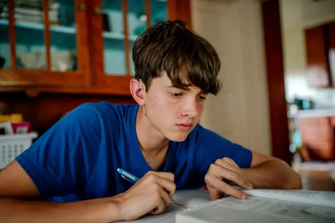15 yr old boy with cochlear implant studying at home