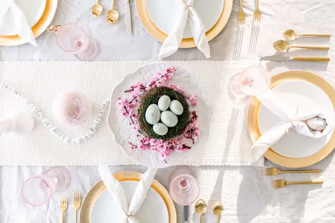 overhead shot of easter tablescape with cherry blossoms
