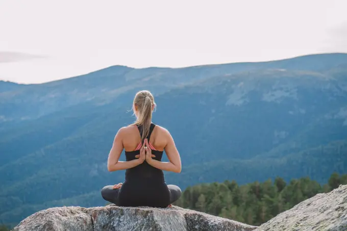 woman meditating yoga mountain postures