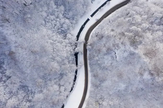 Aerial view of road zigzagging between Zumberak mountains, Croat