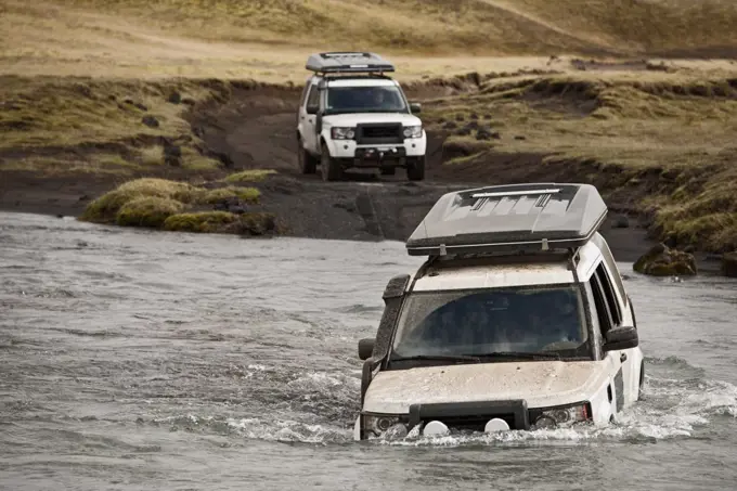 SUV crossing deep river on the Icelandic highlands