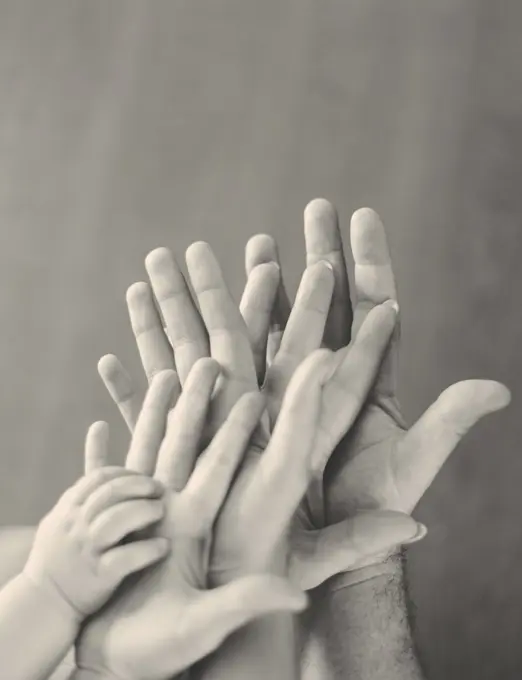 black and white hands with child