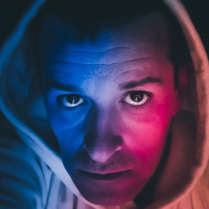 man portrait wit blue and red light