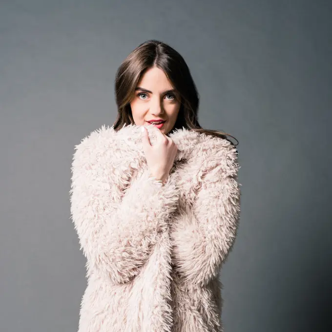 High Fashion Fur Coat on Brunette Model in Studio Coy