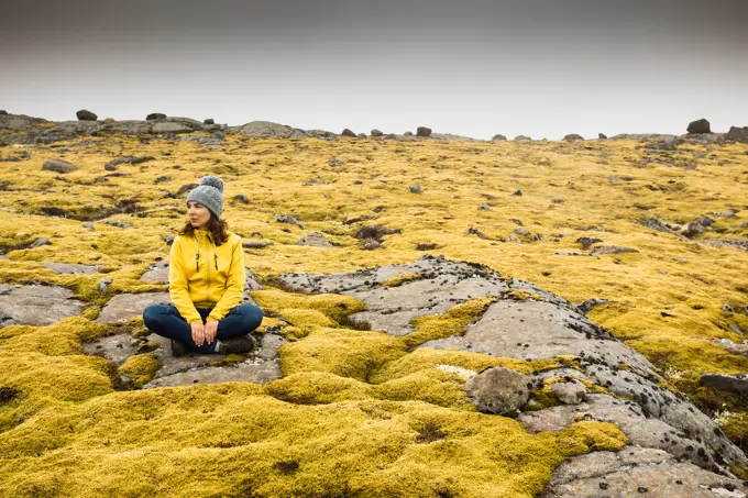 Woman Surrounded by Icelandic moss