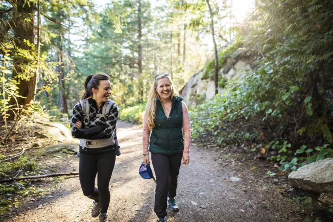 Friends, moms hike, mile and laugh together on hiking trail