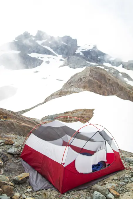 Tent perched on rock below Sky Pilot Mountain