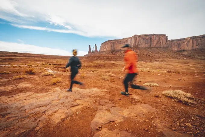 Couple Trail Running Monument Valley Red Dirt