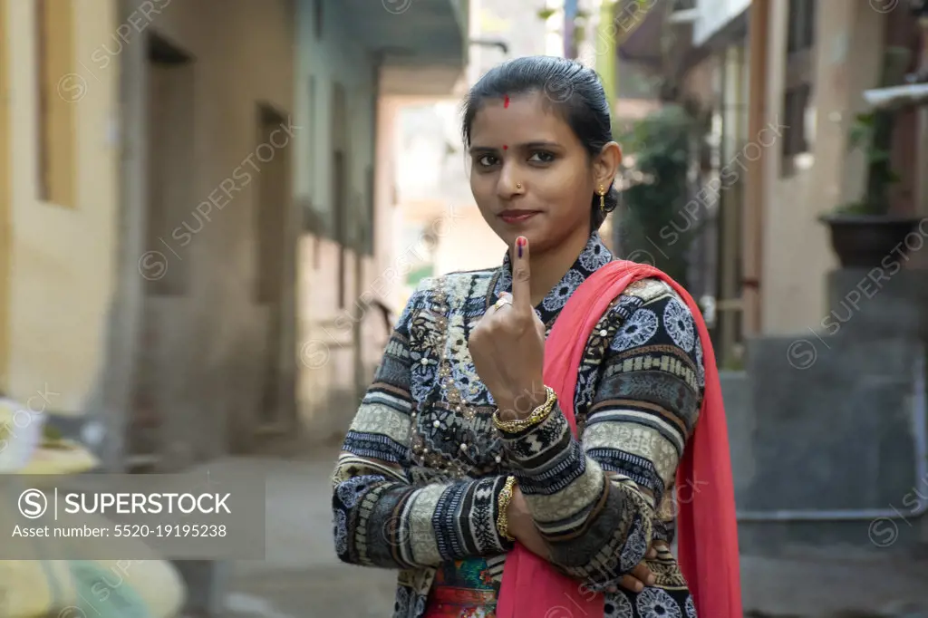 indian woman showing voting mark in hand after polling the Vote