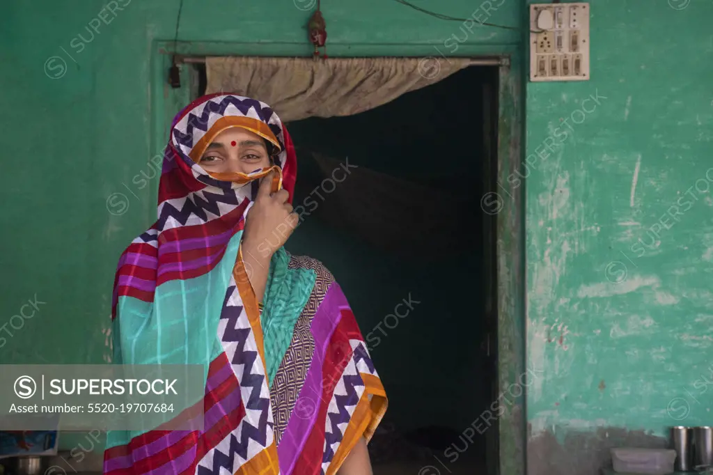Indian woman holding a veil on her head