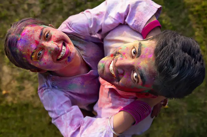 Overhead view of a romantic young couple enjoying Holi