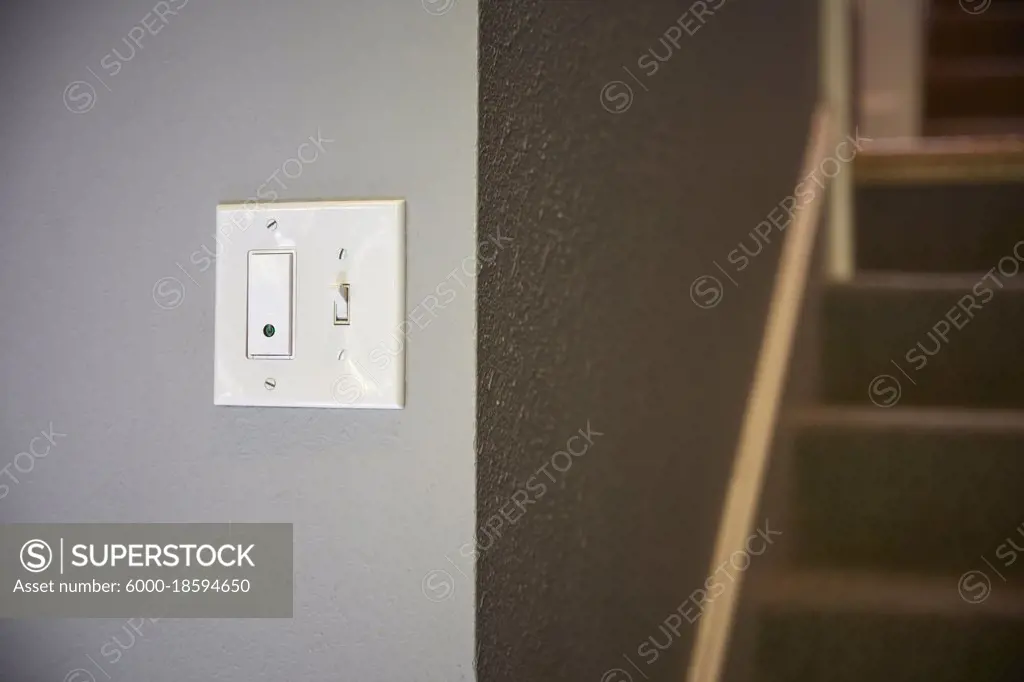 Smart home technology Wi-Fi connected light switch to control home lighting remotely. 