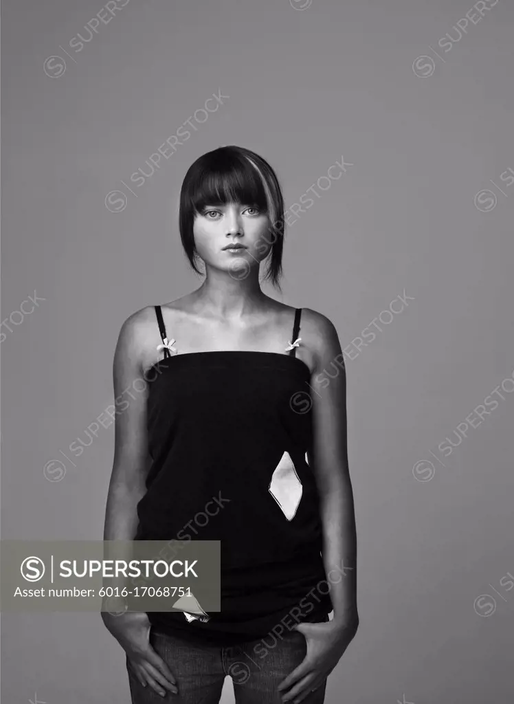 Portrait of young woman in studio with attitude - B&W
