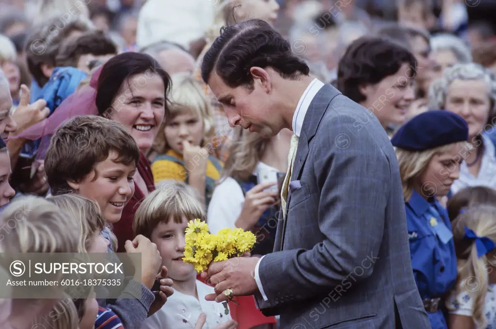 Prince Charles talking to children in crowd and accepting flowers - Royal Tour New Zealand - 1983