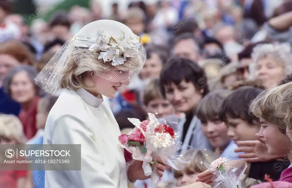 Princess Diana talking to children in crowd and accepting flowers - New Zealand Tour 1983