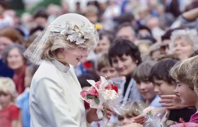 Princess Diana talking to children in crowd and accepting flowers - New Zealand Tour 1983