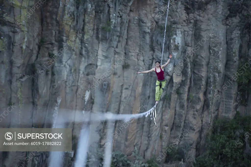 One girl balancing on a highline at "El Gato" canyon