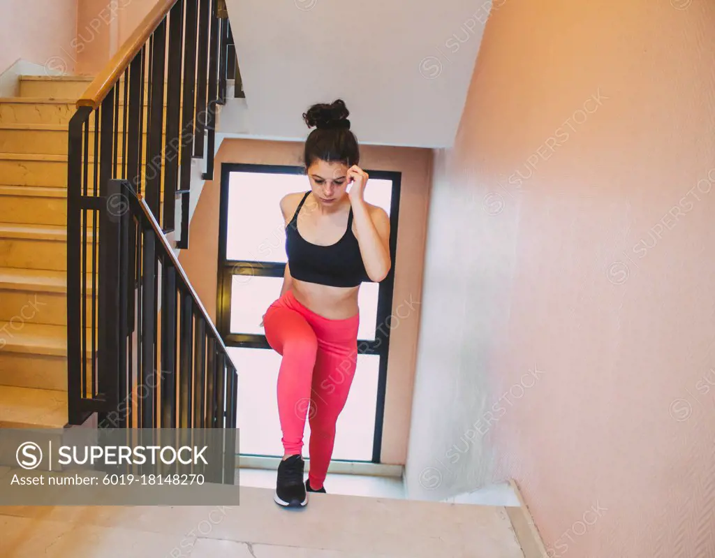 woman exercising going up stairs