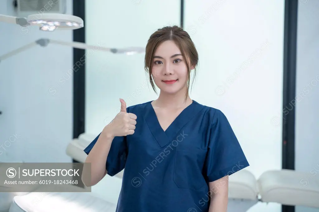 Portrait of beautiful female doctor standing in beauty salon