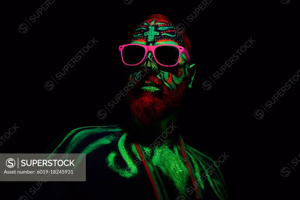 middle-aged man with neon makeup