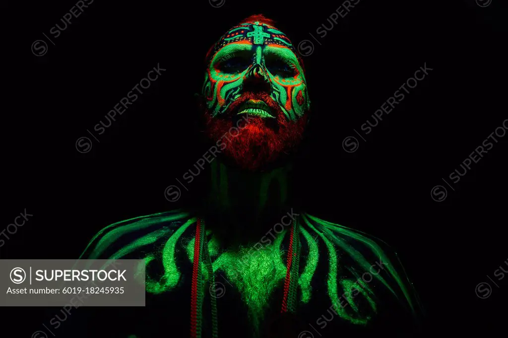 middle-aged man with neon makeup