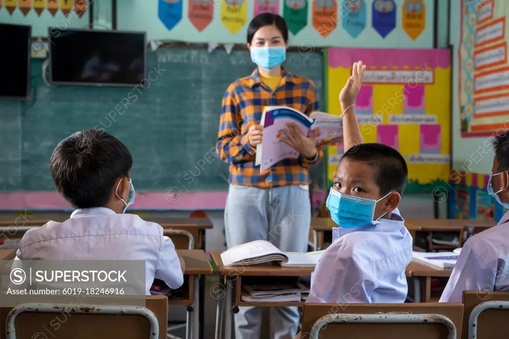 Student with face mask back at school after covid-19 quarantine