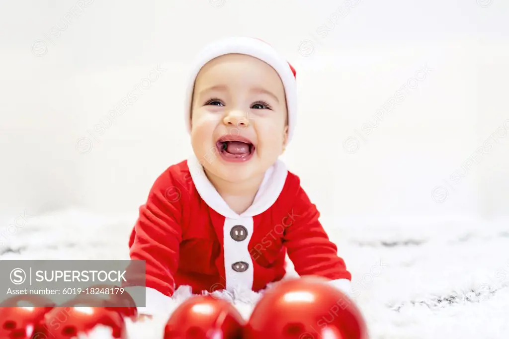 beautiful baby with his santa suit