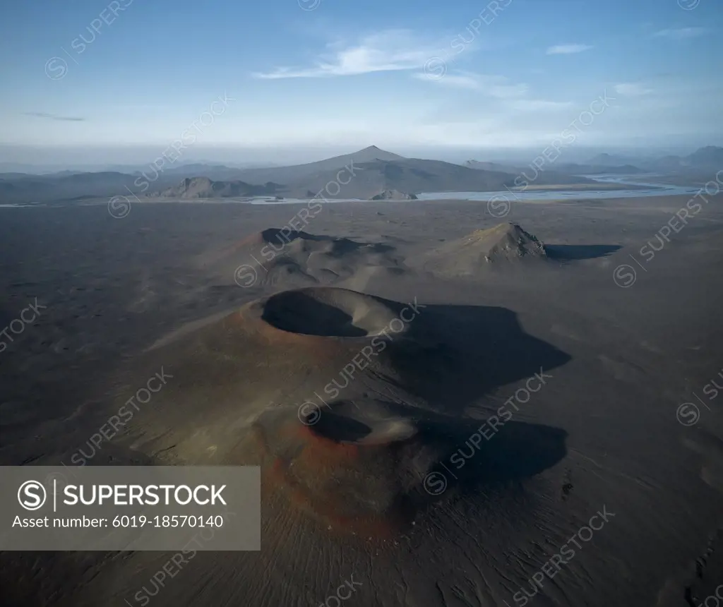 Volcanic desert near river in nature