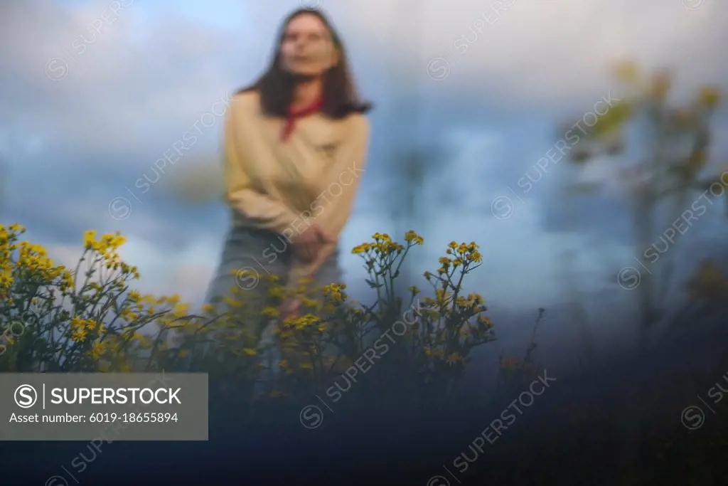 Portrait of confident young woman  in field