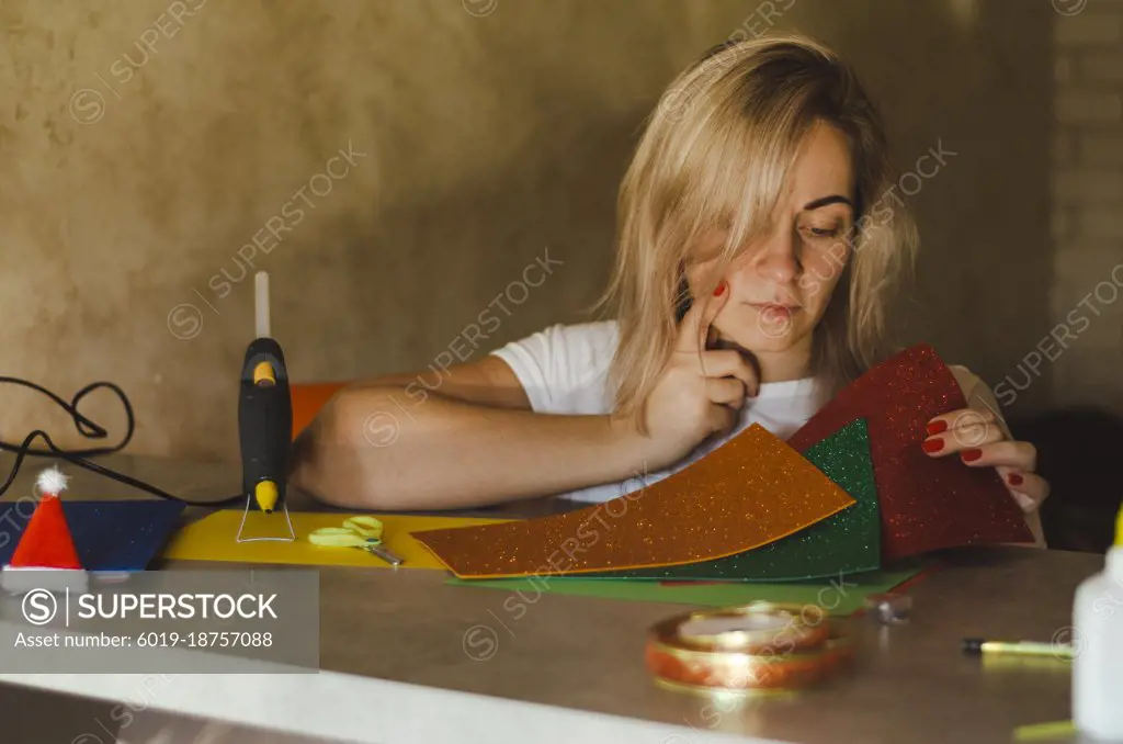 woman examines foamiran for decor